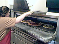 Watching pizzas bake in the oven